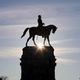 The sun rises behind the Robert E. Lee statue, where streets are closed ahead of expected protests in Richmond, Virginia on January 17, 2021. - Security officials have warned that armed pro-Trump extremists, possibly carrying explosives, pose a threat to Washington as well as state capitals over the coming week.